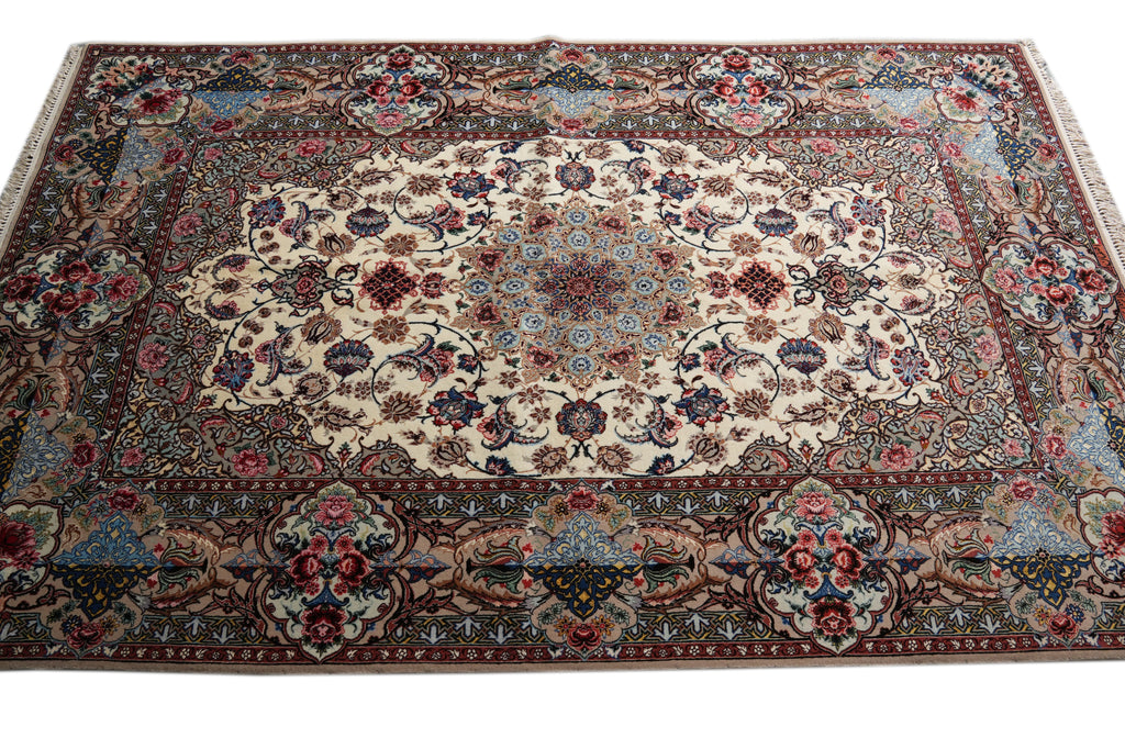 A traditional oriental area rug with an intricate floral and medallion pattern, featuring a cream center, blue and red accents, and a dark brown border.