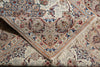 Load image into Gallery viewer, A close-up of an ornate patterned area rug with cream, beige, and dusty blue tones, featuring intricate floral motifs and a fringed edge.