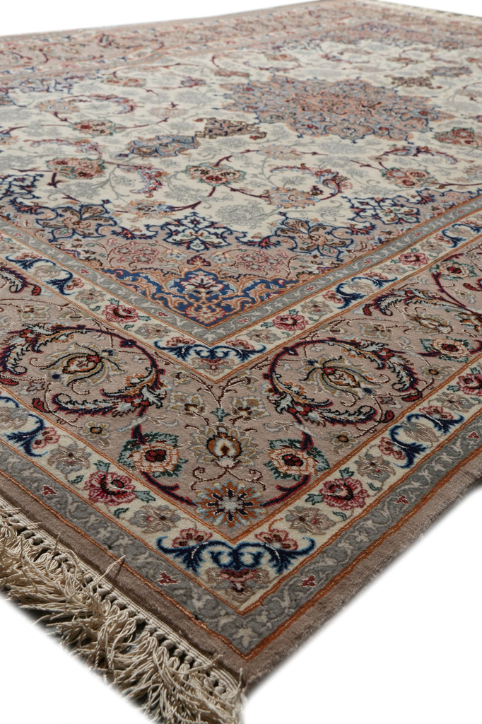 A traditional oriental area rug with an intricate floral and medallion pattern, featuring a beige base with blue, red, and brown accents, finished with a fringed edge.