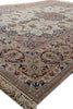 Load image into Gallery viewer, A traditional oriental area rug with an intricate floral and medallion pattern, featuring a beige base with blue, red, and brown accents, finished with a fringed edge.