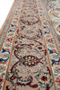 Load image into Gallery viewer, A close-up view of an ornate area rug with a traditional floral and scroll pattern in beige, red, blue, and gray tones.