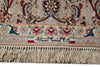 Load image into Gallery viewer, Close-up of an ornate patterned rug with cream, beige, red, blue, and green floral motifs, a decorative border, and tasseled fringe along the bottom edge.
