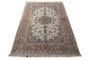 Load image into Gallery viewer, A traditional oriental area rug with an intricate floral pattern, featuring a central medallion, detailed borders, and fringed edges, shown against a plain white background.