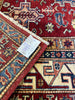 Load image into Gallery viewer, Super Kazak Rug as a Statement Piece in a Boutique: &quot;Fashionable boutique interior with a statement 6x9 red Super Kazak rug, elevating the shopping experience with its bold design and color.&quot;