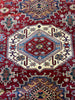 Load image into Gallery viewer, Dining Room Enhanced by Super Kazak Rug: &quot;Elegant dining room set upon a luxurious 6x9 red Super Kazak rug, blending traditional and contemporary styles in home decor.&quot;