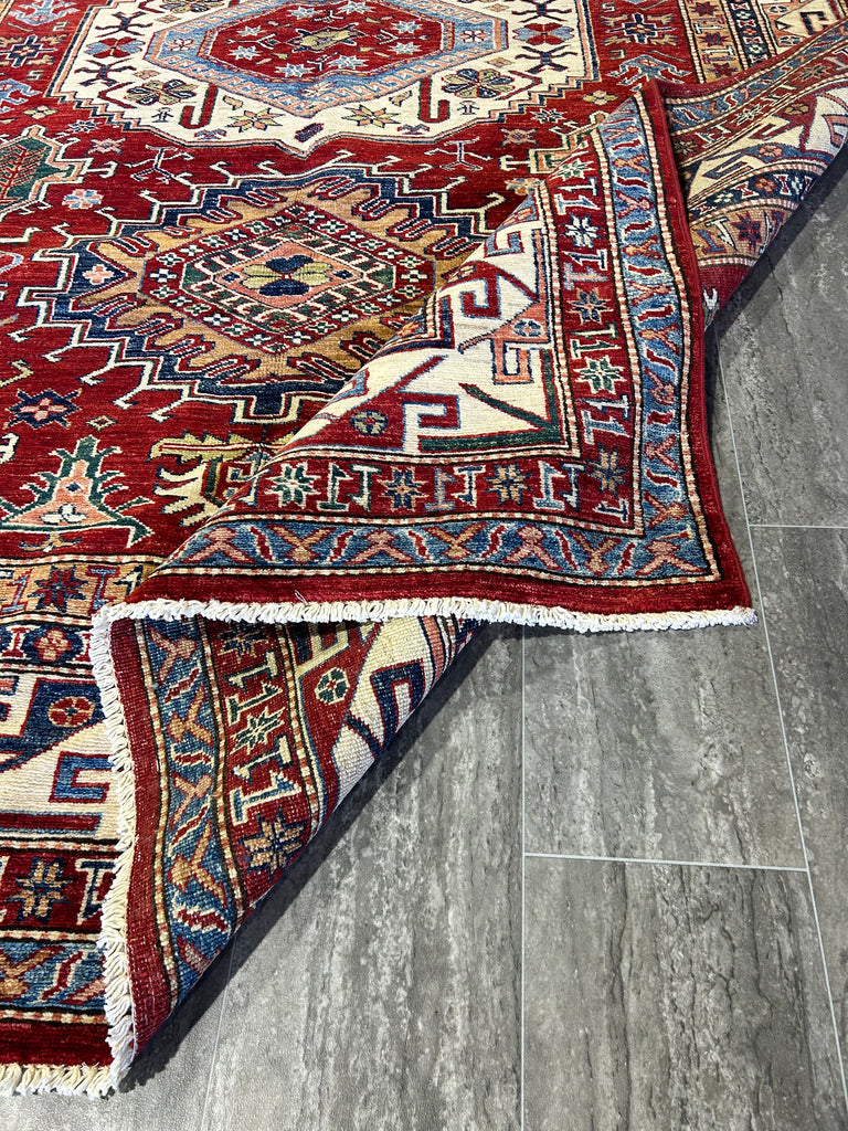 Luxurious Living Space Featuring Red Wool Rug: "Luxurious living space featuring a sophisticated 6x9 red Super Kazak rug as the centerpiece, blending seamlessly with elegant furnishings."