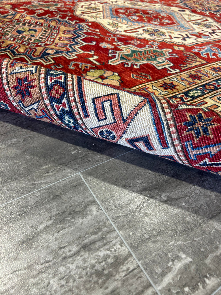Image of Artisan Weaving Super Kazak Rug: "Artisan expertly weaving a traditional 6x9 Super Kazak rug, highlighting the craftsmanship and heritage of handmade wool rugs."