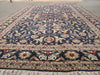Load image into Gallery viewer, A large traditional oriental area rug with a dark navy blue field.