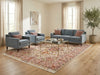 Load image into Gallery viewer, 6.7 x 10.3 Persian Tabriz rug styled in a living room, showing the ivory, pink, and coral medallion design on a light wood floor