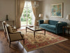 Load image into Gallery viewer, Living room with teal sofa, beige chairs, and a large rug.