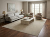 Load image into Gallery viewer, Living room with gray sofa, coffee table, and armchairs.