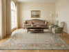 Load image into Gallery viewer, Living room with a floral rug, sofa, and armchairs.