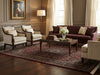 Load image into Gallery viewer, Living room with brown sofa, beige armchairs, and a coffee table with decor items.