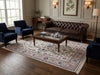 Load image into Gallery viewer, A styled living room featuring a large traditional patterned area rug.