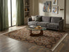 Load image into Gallery viewer, A large traditional-style area rug with a beige, brown, and navy floral pattern is styled in a modern living room setting with a gray sofa, glass coffee table, and wood flooring.