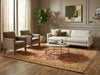Load image into Gallery viewer, Living room with beige sofa, armchairs, and a coffee table on a patterned rug.