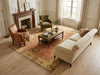 Load image into Gallery viewer, Living room with beige sofa, armchair, and coffee table on a patterned rug.