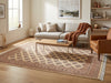 Load image into Gallery viewer, A large rectangular area rug with a beige and brown geometric lattice pattern is shown in a bright, modern living room setting with a light gray sofa, wooden coffee table, and brown leather armchair.
