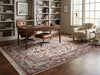 Load image into Gallery viewer, A large traditional-style area rug with an intricate floral and geometric pattern in beige, blue, red, and brown tones, styled in a modern home.