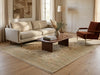Load image into Gallery viewer, A styled living room scene featuring a  large beige patterned area rug on a light wood floor.