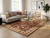 Load image into Gallery viewer, Living room with a patterned rug, sofa, coffee table, and armchair.