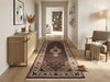 Load image into Gallery viewer, Decorative rug on a wooden floor with a sideboard and armchair in a living room setting.