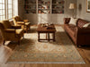 Load image into Gallery viewer, Cozy living room with brown leather furniture and a large rug.