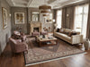 Load image into Gallery viewer, Luxurious living room with beige sofa, armchairs, and decorative elements.