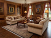 Load image into Gallery viewer, Luxurious living room with a decorative rug.
