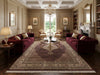 Load image into Gallery viewer, Luxurious living room with decorative rug.