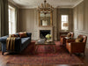 Load image into Gallery viewer, Living room with a decorative rug.