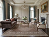 Load image into Gallery viewer, Living room with a decorative rug.