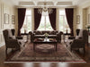 Load image into Gallery viewer, Luxurious living room with brown furniture, large windows, and decorative elements.