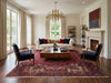 Load image into Gallery viewer, A styled living room featuring a large red patterned area rug.