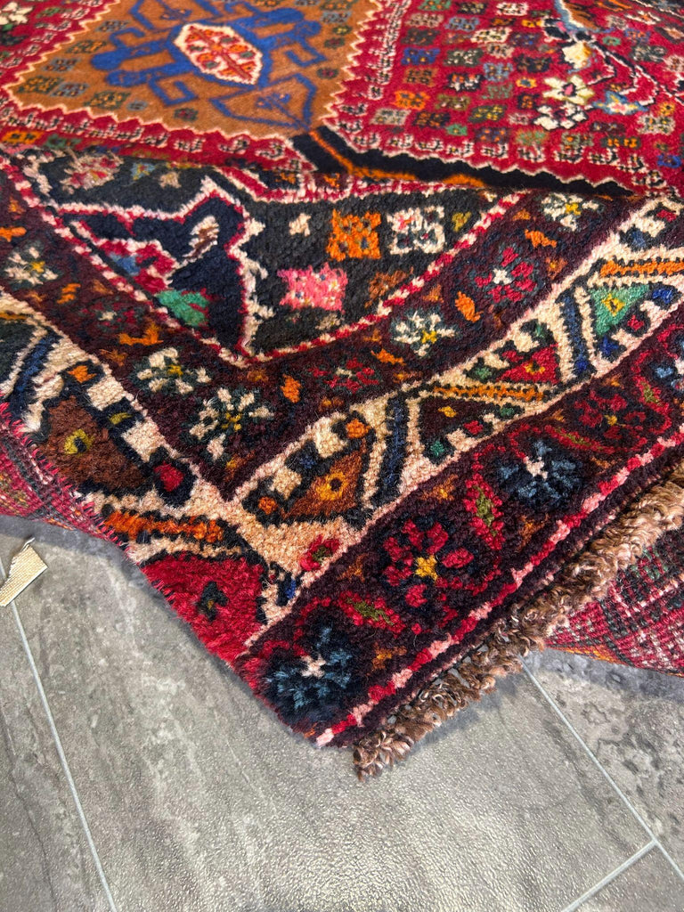 Geometric rug motif detail in gold and ivory on red navy accent rug #P1200
