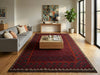 Load image into Gallery viewer, Living room with a red patterned rug, gray sofa, and wooden coffee table.