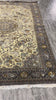 Video of 6.8 x 9.7 antique Persian Tabriz hunting rug, hand-knotted in Iran with 500 KPSI wool pile, showing the pictorial hunting scene design and texture in natural light